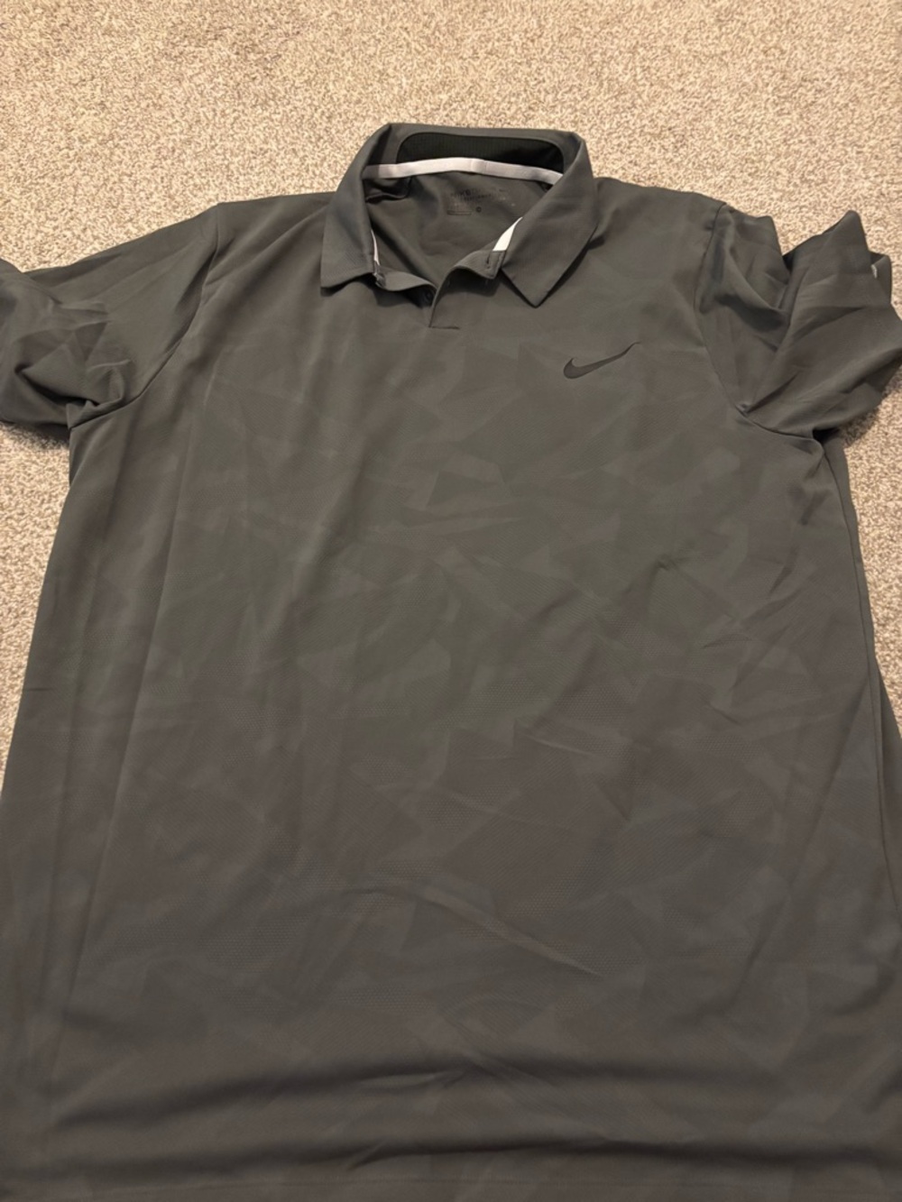 Nike Men's Dark Gray Polo Shirt with Subtle Pattern